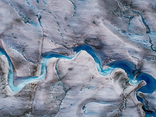 Alaska-Tracy Arm-meltwater streams and ponds on crevassed surface of Sawyer Glacier in Tracy Arm Art Print